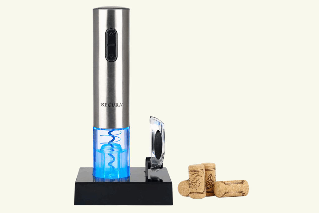 Stainless steel Secura electric wine opener with blue LED light on charging base and corks beside it